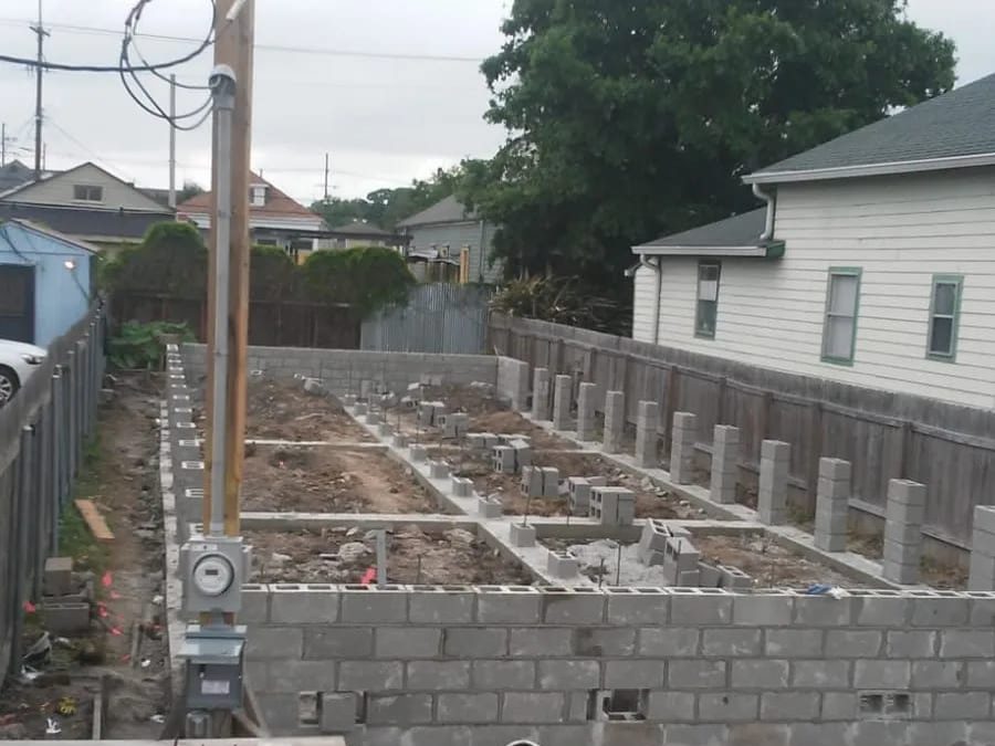 Concrete block foundation walls and piers laid out on a residential lot