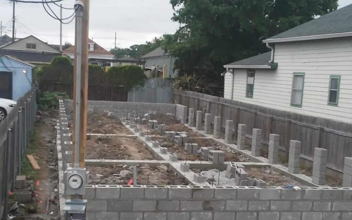 Concrete block foundation walls and piers laid out on a residential lot